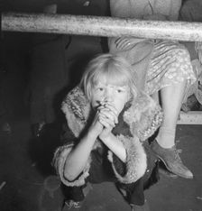 Undernourished cotton picker's child listening to speeches of organizer..., Kern County, CA, 1938. Creator: Dorothea Lange