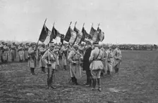 Une remise de decorationsdevant de glorieux drapeaux don’t plusieurs ont ete laceres..., 1916. Creator: Unknown