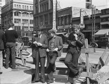 Unemployed young men pause a moment..., Salvation Army, San Francisco, California, 1939. Creator: Dorothea Lange