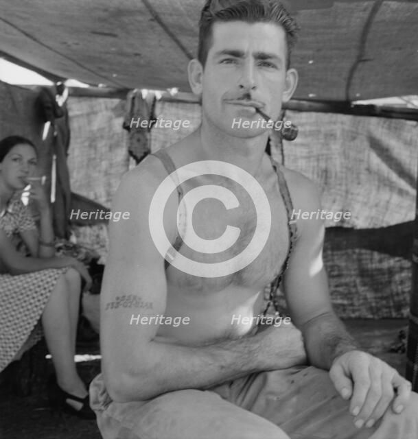 Unemployed lumber worker goes with his wife to the bean harvest, Oregon, 1939. Creator: Dorothea Lange.