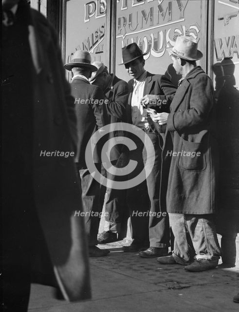 Unemployed men on Howard Street, San Francisco, California, 1937. Creator: Dorothea Lange.