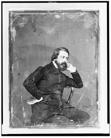 Unidentified man, three-quarter length portrait, three-quarters to the..., between 1844 and 1860. Creator: Mathew Brady