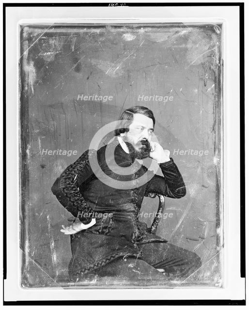 Unidentified man, three-quarter length portrait, three-quarters to the..., between 1844 and 1860. Creator: Mathew Brady.