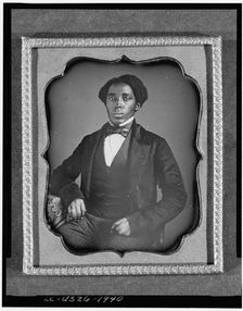 Unidentified man, three-quarter length portrait, full face, with arm on..., between 1849 and 1860. Creator: Unknown