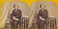 Unidentified man with muttonchops seated, holding a rolled paper, about 1860. Creator: Unknown