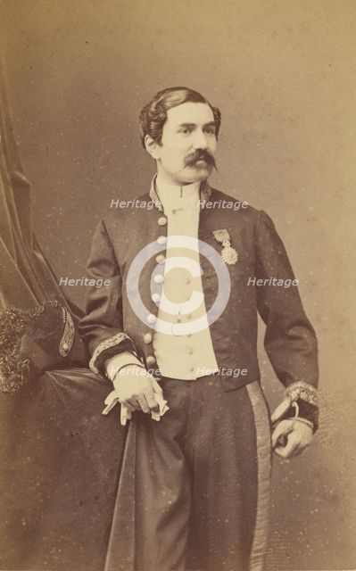 Unidentified man with moustache standing, wearing a medal on his lapel, about 1861. Creator: Bayard & Bertall.