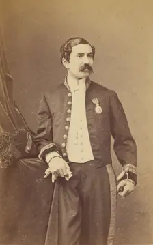 Unidentified man with moustache standing, wearing a medal on his lapel, about 1861. Creator: Bayard & Bertall