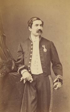 Unidentified man with moustache standing, wearing a medal on his lapel, about 1861. Creator: Bayard & Bertall
