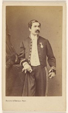 Unidentified man with moustache standing, wearing a medal on his lapel, about 1861. Creator: Bayard & Bertall