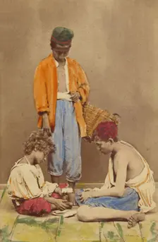 Unidentified man with basket standing, plus two boys seated playing cards, 1865-1870. Creator: Giorgio Conrad