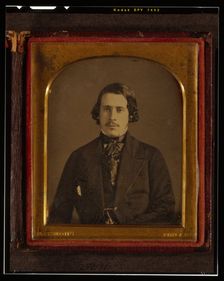 Unidentified man, half-length portrait, seated, facing front, between 1848 and 1860. Creator: Montgomery Simons