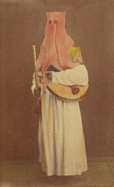 Unidentified man in long hood holding a candle and book, standing, about 1870. Creator: Giorgio Conrad