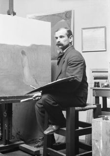 Unidentified man, seated at his easel, portrait photograph, between 1896 and 1942. Creator: Arnold Genthe