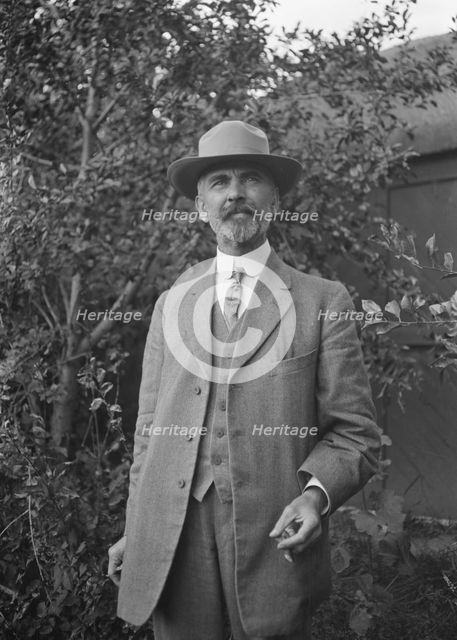 Unidentified man, standing outdoors, between 1896 and 1942. Creator: Arnold Genthe.