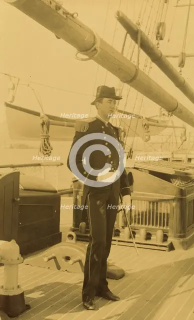 Unidentified naval officer, full-length portrait, standing aboard ship, facing right, 1894 or 1895. Creator: Alfred Lee Broadbent.