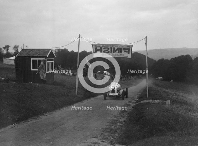 Unidentified offset single-seater car finishing the Shelsley Walsh Hillclimb, Worcestershire, 1935. Artist: Bill Brunell.