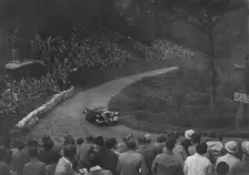 Unidentified open 4-seater car competing in the Shelsley Walsh Hillclimb, Worcestershire, 1935. Artist: Bill Brunell