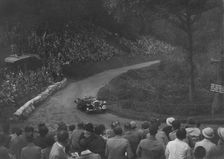 Unidentified open 4-seater car competing in the Shelsley Walsh Hillclimb, Worcestershire, 1935. Artist: Bill Brunell
