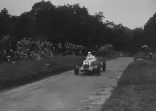 Unidentified open single-seater car competing in the Shelsley Walsh Hillclimb, Worcestershire, 1935. Artist: Bill Brunell