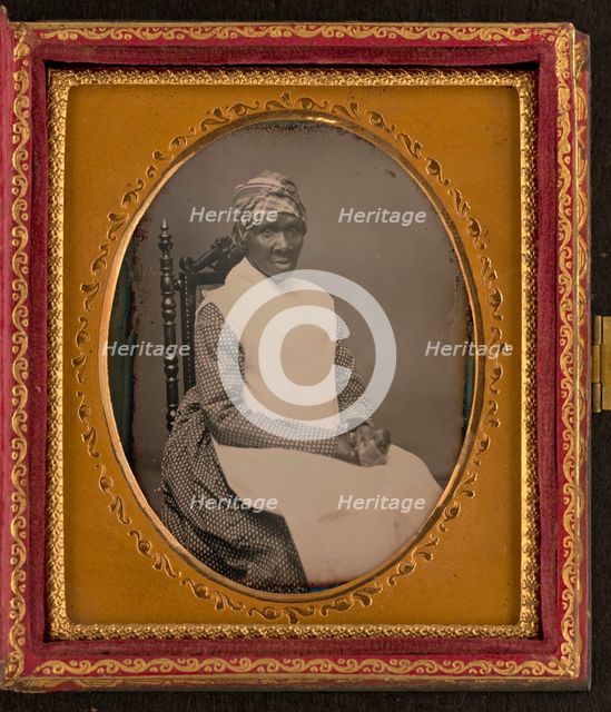 Unidentified African American woman in headscarf and apron, between 1850 and 1870. Creator: Unknown.