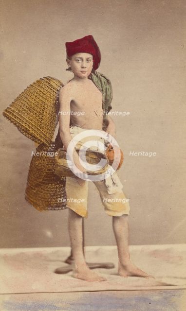 Unidentified boy wearing native costume with baskets on back and carrying a water jug..., 1870-1875. Creator: Giorgio Conrad.