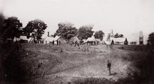 [Unidentified camp with ruined chimneys in background]. Brady album, p. 130, 1861-65. Creator: Unknown