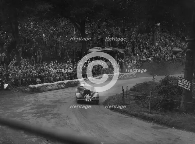 Unidentified car with supercharger competing in the Shelsley Walsh Hillclimb, Worcestershire, 1935. Artist: Bill Brunell.