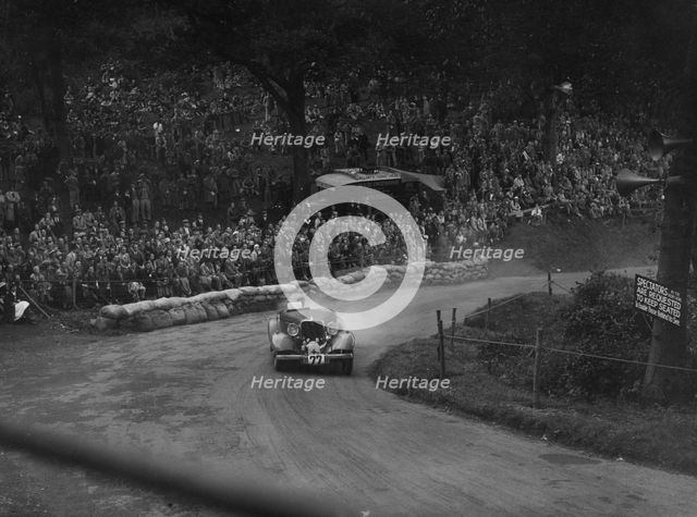 Unidentified car with supercharger competing in the Shelsley Walsh Hillclimb, Worcestershire, 1935. Artist: Bill Brunell.