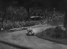 Unidentified car with supercharger competing in the Shelsley Walsh Hillclimb, Worcestershire, 1935. Artist: Bill Brunell