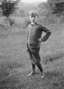 Unidentified child, standing outdoors, between 1896 and 1942. Creator: Arnold Genthe