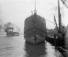 Unidentified freighter, Detroit, Michigan, with passenger steamer Britannia..., c1906-1915. Creator: Unknown