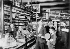 Unidentified grocery store, probably in Germany, between 1900 and 1910. Creator: Unknown