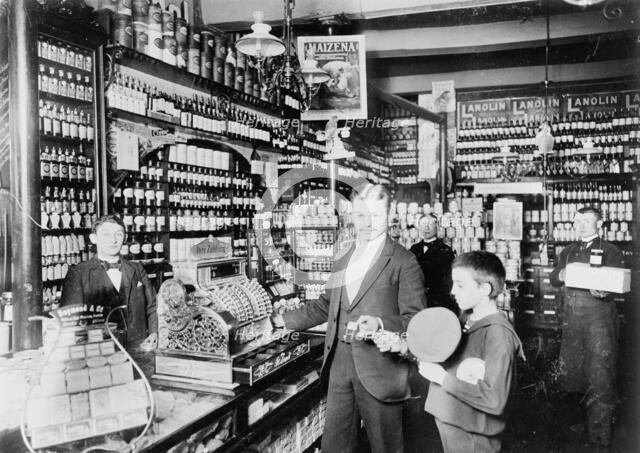 Unidentified grocery store, probably in Germany, between 1900 and 1910. Creator: Unknown.