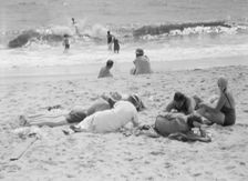 Unidentified group of people, possibly members of the Jewett family, at the beach, c1911-1942. Creator: Arnold Genthe