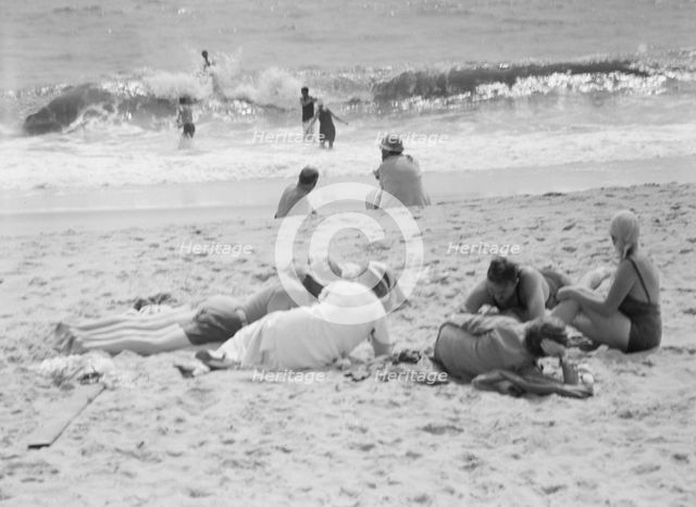 Unidentified group of people, possibly members of the Jewett family, at the beach, c1911-1942. Creator: Arnold Genthe.