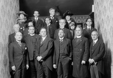 Unidentified Group On Entrance Stairway of John Barrett's Residence; 12 Men, 3 Women, Child, 1915. Creator: Harris & Ewing