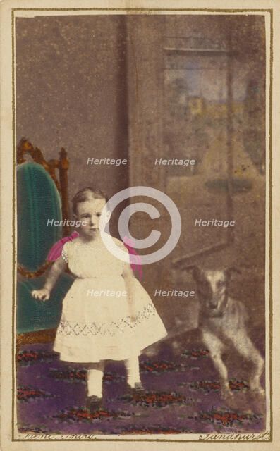 Unidentified little girl standing with a dog on the floor next to her, 1865-1875. Creator: Bent.
