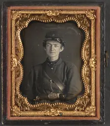Unidentified soldier in Union uniform of the 119th Pennsylvania Volunteer..., between 1861 and 1865. Creator: Unknown