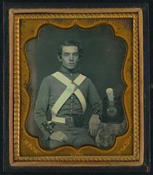 Unidentified soldier of 7th New York Infantry Regiment in uniform graphic /, between 1861 and 1863. Creator: Rufus Anson