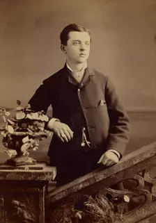 Unidentified well-dressed young man, standing, about 1880. Creator: Gardner