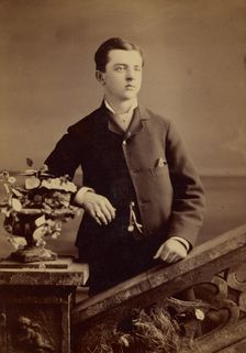 Unidentified well-dressed young man, standing, about 1880. Creator: Gardner