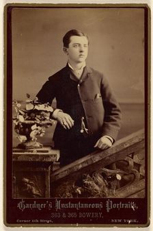 Unidentified well-dressed young man, standing, about 1880. Creator: Gardner