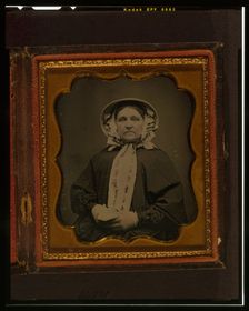 Unidentified woman, half-length portrait, wearing gloves, between 1840 and 1860. Creator: Unknown