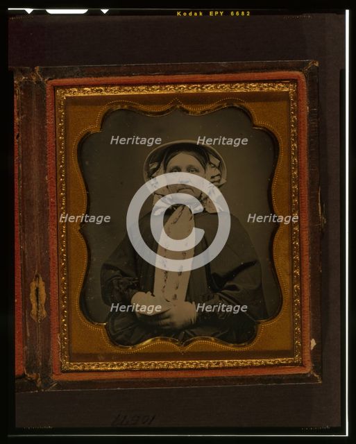 Unidentified woman, half-length portrait, wearing gloves, between 1840 and 1860. Creator: Unknown.