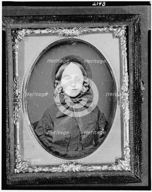 Unidentified woman, head-and-shoulders portrait, facing front, between 1851 and 1860. Creator: Rufus Anson.