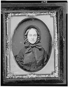 Unidentified woman, head-and-shoulders portrait, facing front, between 1851 and 1860. Creator: Rufus Anson