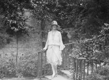 Unidentified woman, standing outdoors, c1920s. Creator: Arnold Genthe