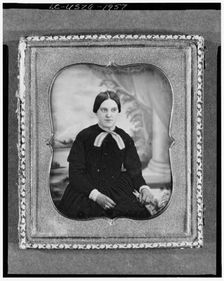 Unidentified woman, three-quarter length portrait, facing front, seated..., between 1840 and 1860. Creator: Unknown