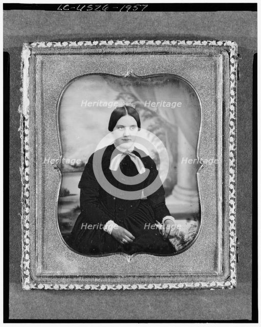 Unidentified woman, three-quarter length portrait, facing front, seated..., between 1840 and 1860. Creator: Unknown.