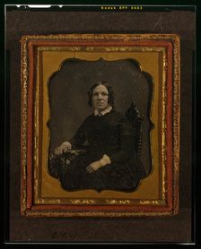 Unidentified woman, three-quarters length portrait, seated in chair with right arm..., ca. 1855. Creator: Francis Grice